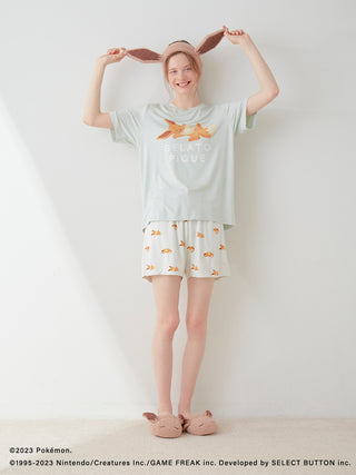Person wearing a Pokémon Sleep unisex baby Moco Eevee hair band and matching pajamas, showcasing fun and cozy nightwear.
