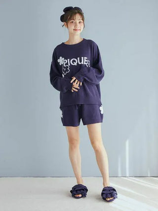 Woman wearing Gelato Pique loungewear and Airy Moco Tiered House Slippers standing in a relaxed pose.