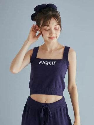 Model wearing navy Airy Moco Flower Logo Jacquard Cropped Tank Top by Gelato Pique, showcasing soft fabric and stylish design.