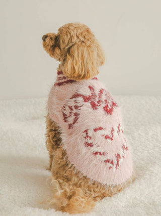 Dog wearing a pink Cat & Dog Feather Pullover with heart patterned candy cane jacquard, part of the Sending Warm Wishes collection.