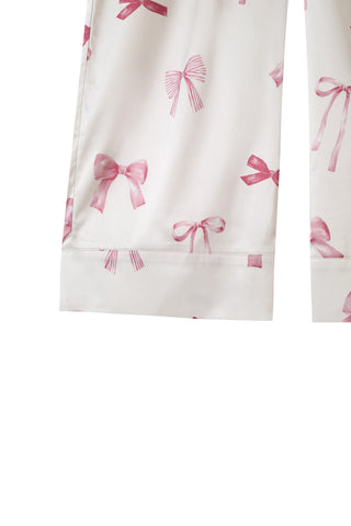 Close-up of long pants with pink ribbon print, part of the Ribbon Shirt & Long Pants Set, showcasing silky-soft fabric and elegant design.