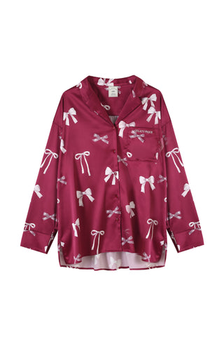 Elegant pink ribbon printed shirt with embroidered chest pocket, featuring silky-soft fabric, notched collar, and button closure.