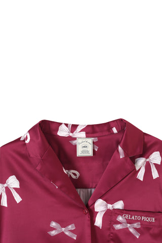 Ribbon shirt featuring a pink all-over ribbon print, notched collar, and chest pocket with Gelato Pique embroidery.
