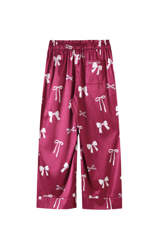 Long pants with pink and white ribbon print, silky fabric, relaxed fit, part of elegant Ribbon Shirt & Long Pants Set.