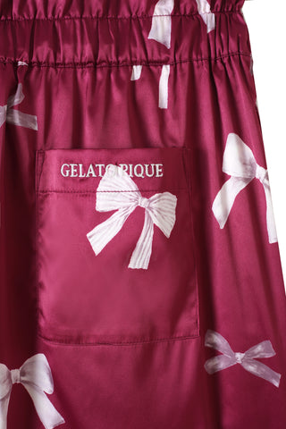 Close-up of pink ribbon print long pants with Gelato embroidered pocket.