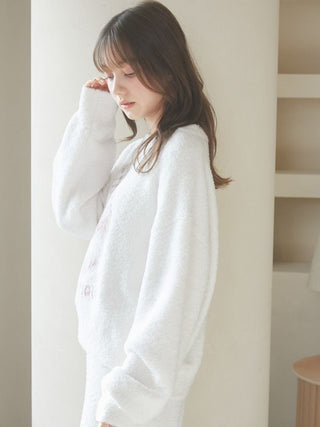 Woman wearing Baby Moco CAT JQD Pullover Sweater with fluffy texture and relaxed sleeves.