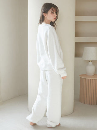 Woman wearing Baby Moco Cat Long Lounge Pants from Gelato Pique USA, showcasing plush, cozy loungewear in an elegant indoor setting.