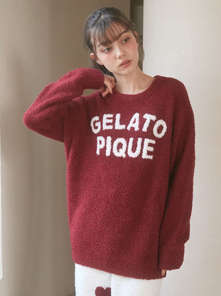 Woman wearing Chocolate & Framboise Baby Moco Pullover Sweater by Gelato Pique, showing a relaxed fit and bold logo.