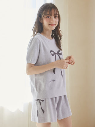 Woman wearing Gelato Pique USA ribbon jacquard pullover sweater with puff sleeves, featuring premium loungewear in off-white color.