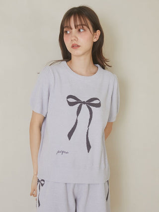 Woman wearing Gelato Pique USA Ribbon Jacquard Pullover Sweater with puff sleeves in blue, featuring premium loungewear ribbon design.