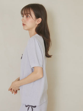 Woman wearing Gelato Pique USA Ribbon Jacquard Pullover Sweater, premium loungewear with puff sleeves and ribbon motif in light blue.