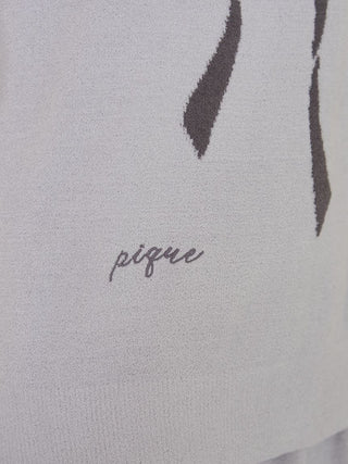 Close-up of Ribbon Jacquard Pullover Sweater with cursive logo embroidery by Gelato Pique USA, a premium loungewear brand.