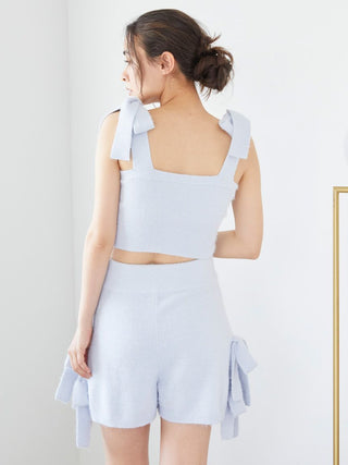 Woman wearing Ribbon Lounge Shorts with playful ribbon accents and soft fabric for a cozy lounge look.