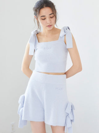 Model wearing Gelato Pique Ribbon Lounge Shorts with plush fabric and bow designs, showcasing playful and cozy style.