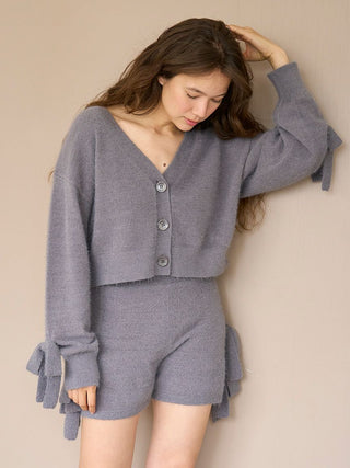 Woman wearing gray Ribbon Lounge Shorts with ribbon accents, paired with matching cozy sweater.