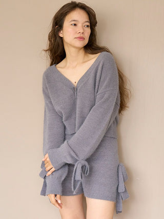 Woman wearing grey Ribbon Lounge Shorts with soft, plush fabric and ribbon accents, exuding comfort and playfulness.