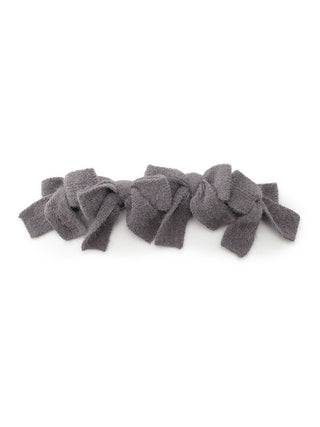 Soft plush bow hair ribbon in dark gray, exuding elegant and playful style with voluminous multi-bow design, made from plush fabric.