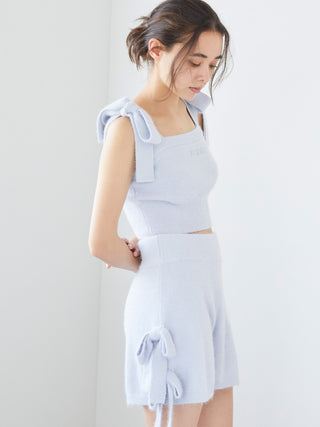 Woman wearing Gelato Pique Ribbon Lounge Shorts with ribbon accents, side view showcasing soft, plush fabric and playful design.