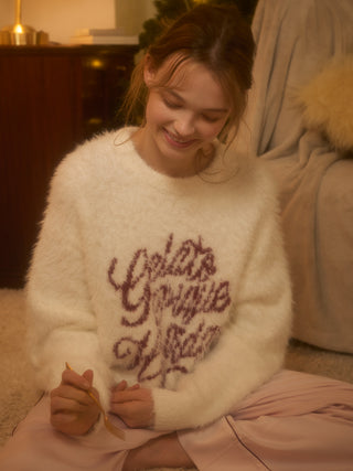 Cozy Feather Pullover Sweater with festive design, ideal for warmth and comfort during the holidays, worn by a person relaxing indoors.
