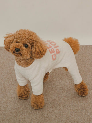 Alt Tag: Brown dog wearing a cozy white CAT&DOG Smoothie Jacquard Romper with pink text, showcasing stylish comfort.