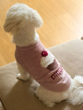 Alt Tag: Small dog wearing CAT&DOG Cupcake Sleeveless Pet Clothes with cupcake design, sitting on sofa.