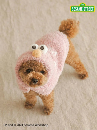 Cute dog wearing a fluffy pink Elmo cape from Sesame Street's CAT & DOG collection.