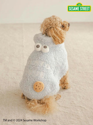 Dog wearing a fluffy Cookie Monster cape from Sesame Street collection, featuring a cookie design and googly eyes.