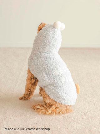 Dog wearing Sesame Street Cookie Monster costume cape for pets on light background.