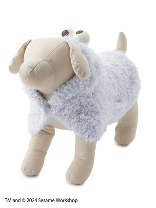 Stuffed dog wearing a Cookie Monster cape from Sesame Street, designed for pets.
