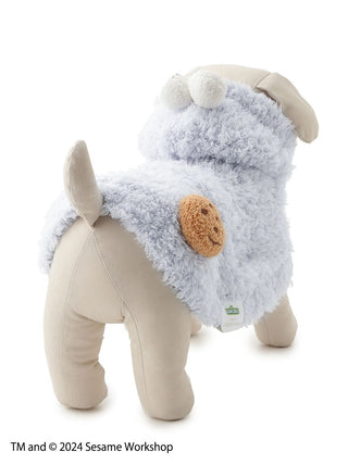 Dog wearing a Cookie Monster cape from Sesame Street, featuring soft blue material and a cookie patch. Perfect for pet costumes.