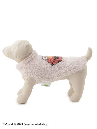 Plush dog wearing a Sesame Street Elmo Jacquard Pullover, highlighting texture and design for pet apparel enthusiasts.