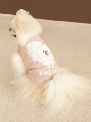 Cute Pomeranian wearing CAT&DOG Baby Moco pet clothes, featuring a soft pink sweater with a fluffy design.