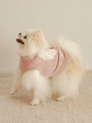 Pomeranian wearing CAT&DOG Baby Moco pet clothes, pink sweater with white accents, showcasing luxurious and cozy design.