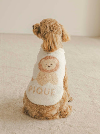 Dog wearing CAT&DOG Baby Moco Animal Pet Clothes featuring a cute lion design, fully wrapped and seated on a beige carpet.