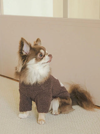 Small dog wearing CAT&DOG Heart Bear Jacquard pet clothes, showcasing cozy brown fabric with heart design, perfect for warmth and style.