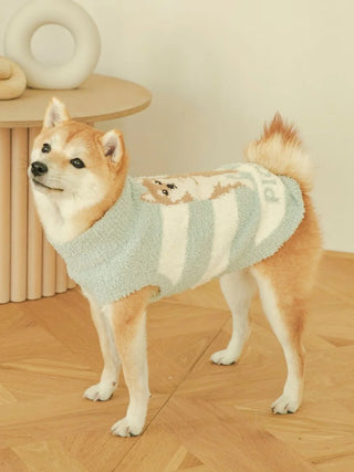 Shiba Inu wearing blue and white CAT&DOG Baby Moco pet clothes with cute design, standing indoors on wooden floor.