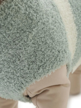 Close-up of fluffy green Shiba Inu pet clothes from CAT&DOG Baby Moco collection, showcasing soft texture and quality material.