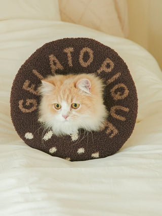 Fluffy kitten wearing a CAT&DOG Baby Moco Donut Pet Neck Pillow on a bed.