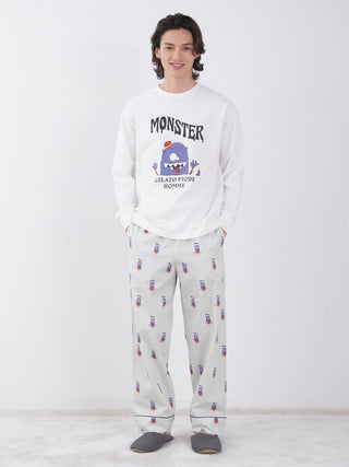 Man wearing KAZUSA MATSUYAMA Monster Pattern Lounge Pants, featuring playful hotel porter motif, from GELATO PIQUE HOMME collection.