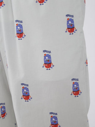 Close-up of KAZUSA MATSUYAMA Monster Pattern Lounge Pants with playful monster motif on light fabric, part of a limited edition collection.