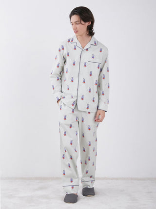 Person wearing KAZUSA MATSUYAMA Monster Pattern Long Sleeve Sleep Shirt, featuring whimsical monster design, standing on white background.