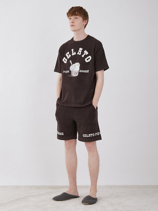 Man wearing Men's Logo Jacquard Lounge Shorts and matching T-shirt in a casual home setting.