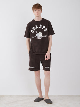 Model wearing Men's Logo Jacquard Lounge Shorts in black with HOMME bear design, showcasing comfortable and stylish summer loungewear.