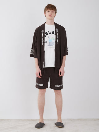 Man wearing Men's Logo Jacquard Lounge Shorts and matching top, showcasing comfort and premium style, from the HOMME original bear jacquard series.