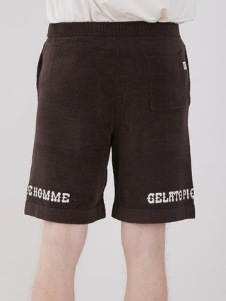Back view of Men's Logo Jacquard Lounge Shorts in brown, featuring white logo text at hem, ideal for summer comfort and style.