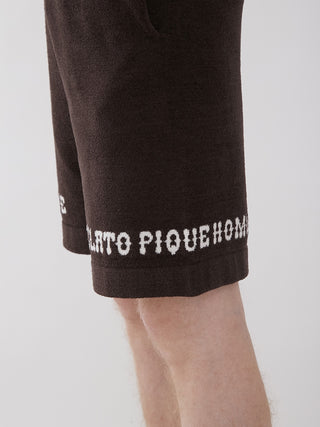 Men's Logo Jacquard Lounge Shorts in black showing side detail with logo text on hem.