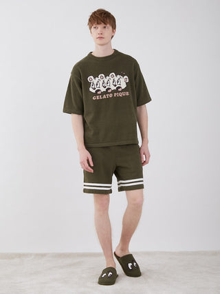 Man wearing KOUSUKE SHIMIZU Air Moco Lounge Shorts and matching top by GELATO PIQUE HOMME in green.