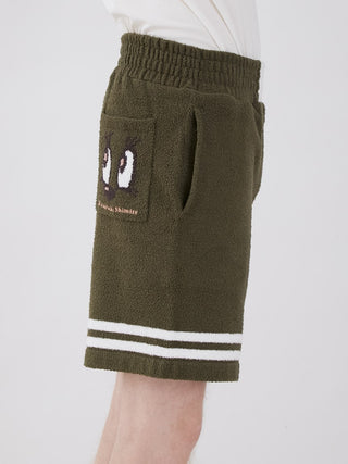 KOUSUKE SHIMIZU Air Moco Lounge Shorts for Men in olive green with stripe detail, featuring a unique graphic by artist Mr. Kousuke Shimizu.