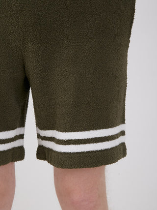 Close-up of KOUSUKE SHIMIZU Air Moco Lounge Shorts in dark green with white stripes, showcasing soft texture.