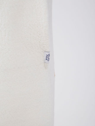 Close-up of fabric texture and tag on Air Moco Sleepy Bear Lounge Shorts highlighting plush material and brand label.
